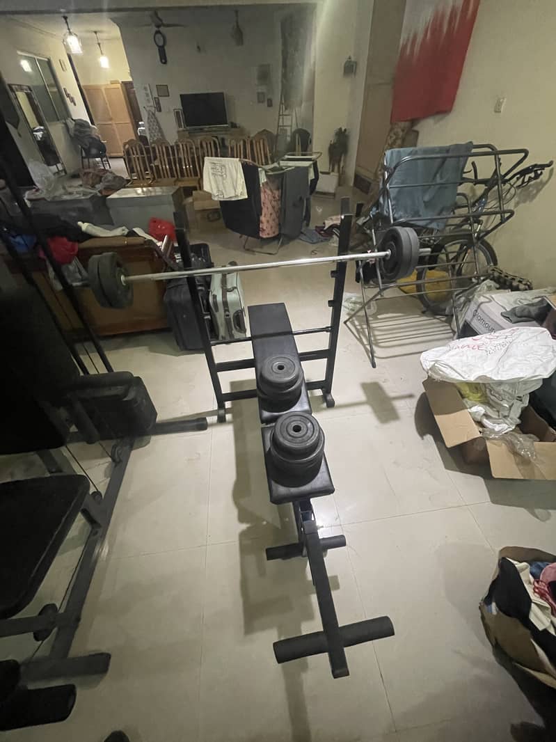 Bench press with rubber coated plates & 5 ft rod 0