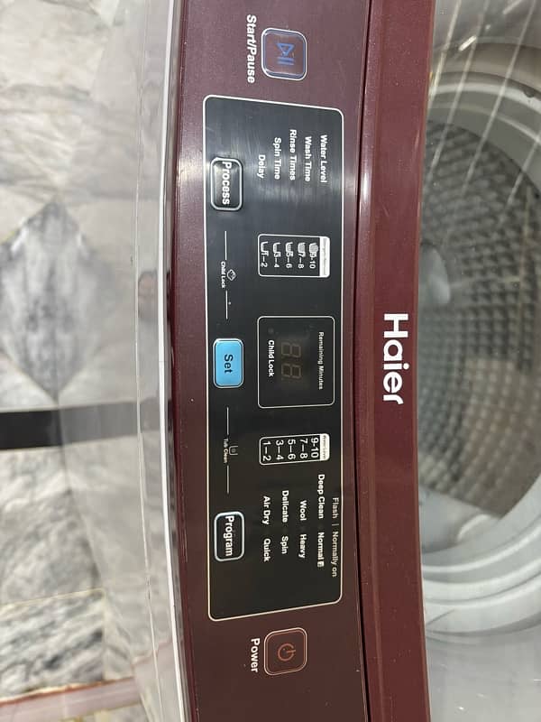 Haier medium sized top load washing machine 11