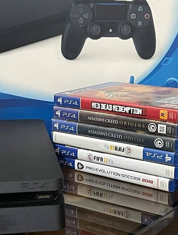 PS4 with 3 controllers and games 2