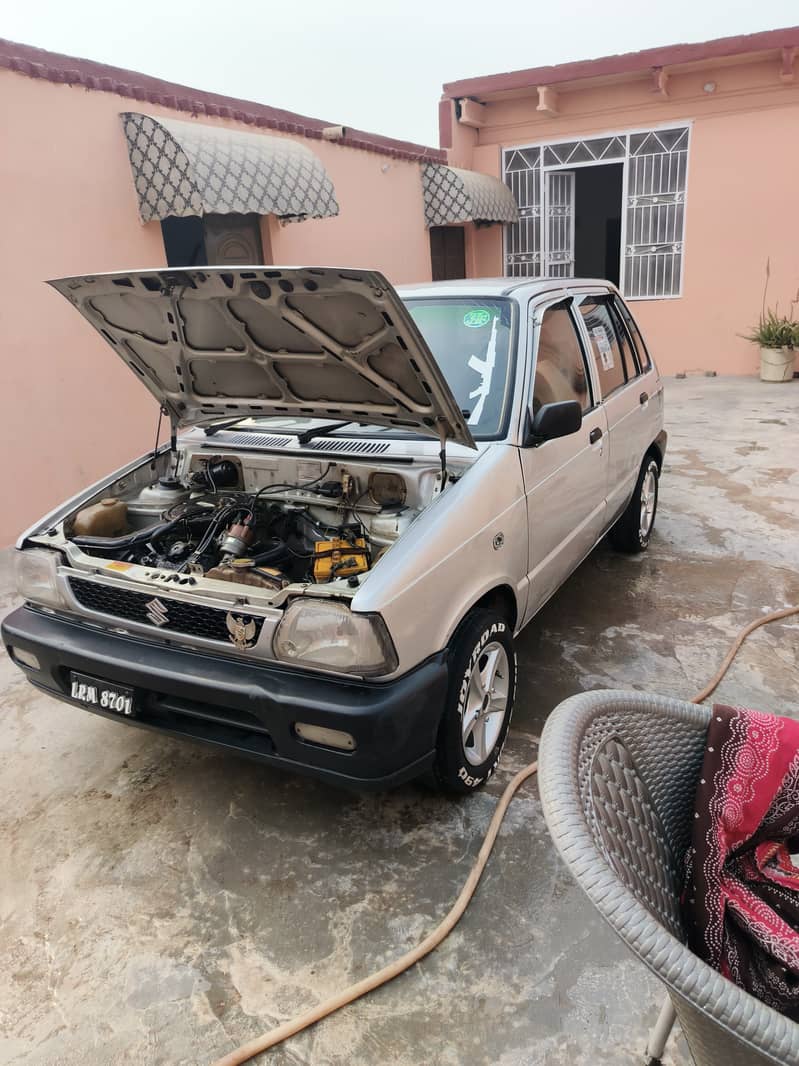 Mehran ha 2003 model outer 40 percentage inner tptal jeniun 7