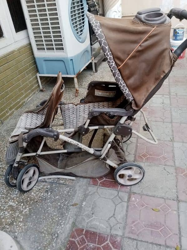 3 kids cycles and a pram in a very good condition 8