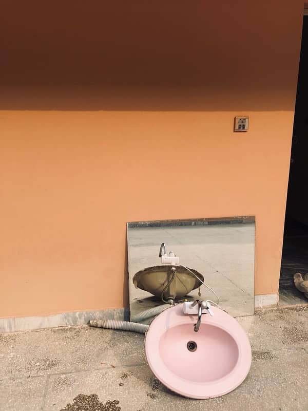 pink Porta wash basin with mirror and commode 1