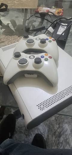 x box360 for sale in 100% working condition with 64 games  installed