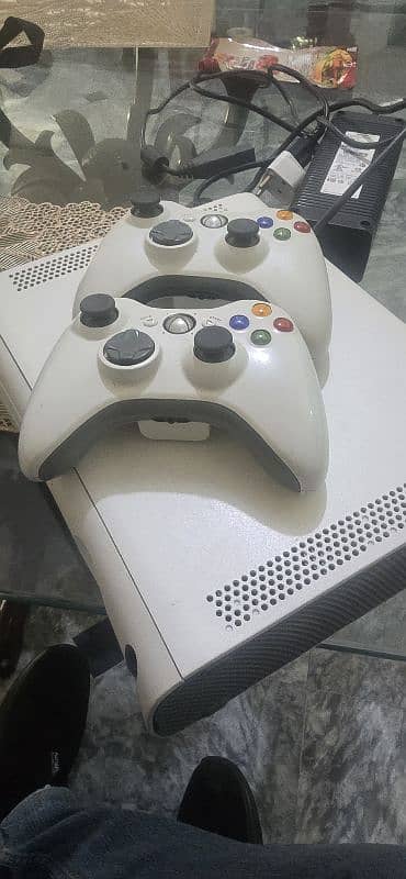 x box360 for sale in 100% working condition with 64 games  installed 0