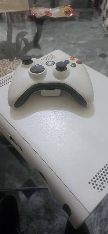 x box360 for sale in 100% working condition with 64 games  installed 2