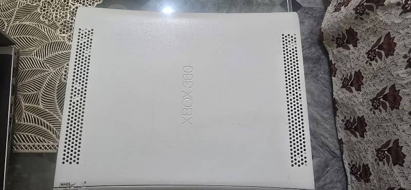 x box360 for sale in 100% working condition with 64 games  installed 5