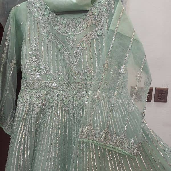 An embroidered frock in sky blue colour elegant yet decent 2