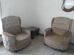 2 single seater sofa set with a coffee table