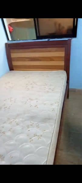 single bed wooden in good condition, slightly used foam under warranty 1