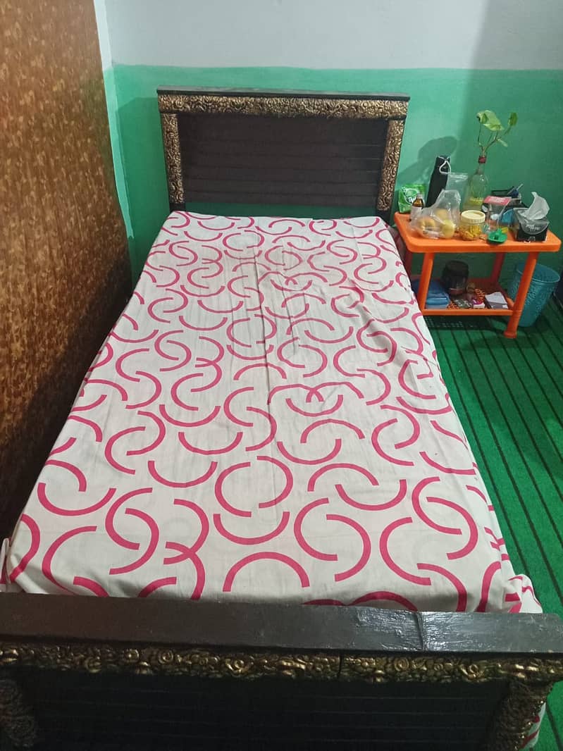 One wooden single bed with foam for sale. 0