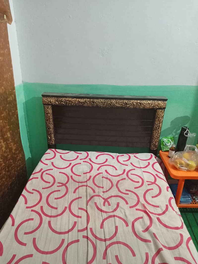 One wooden single bed with foam for sale. 2