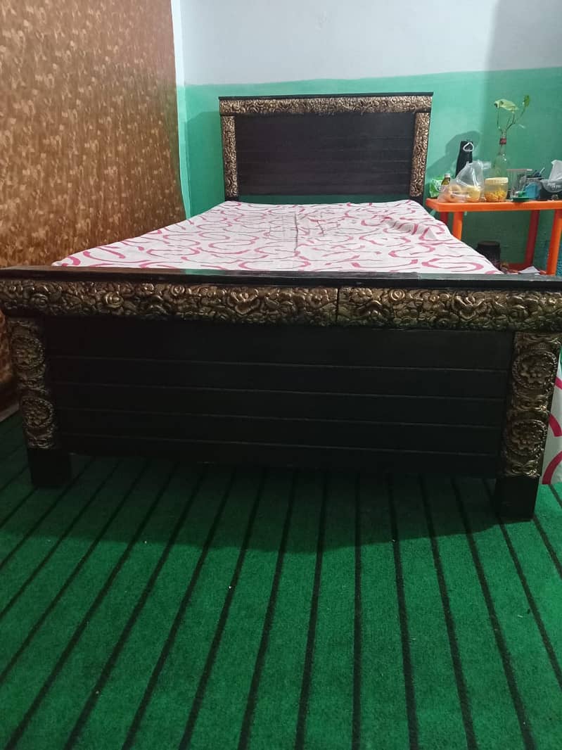 One wooden single bed with foam for sale. 3