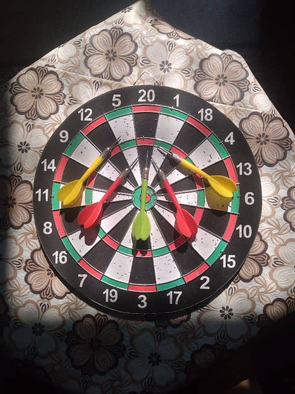 one second hand carram board and one second hand dart board 9