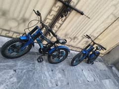 2 bicycle and 2 scooty