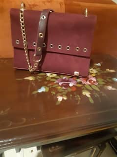 Maroon colour Shoulder bag for sale in good condition