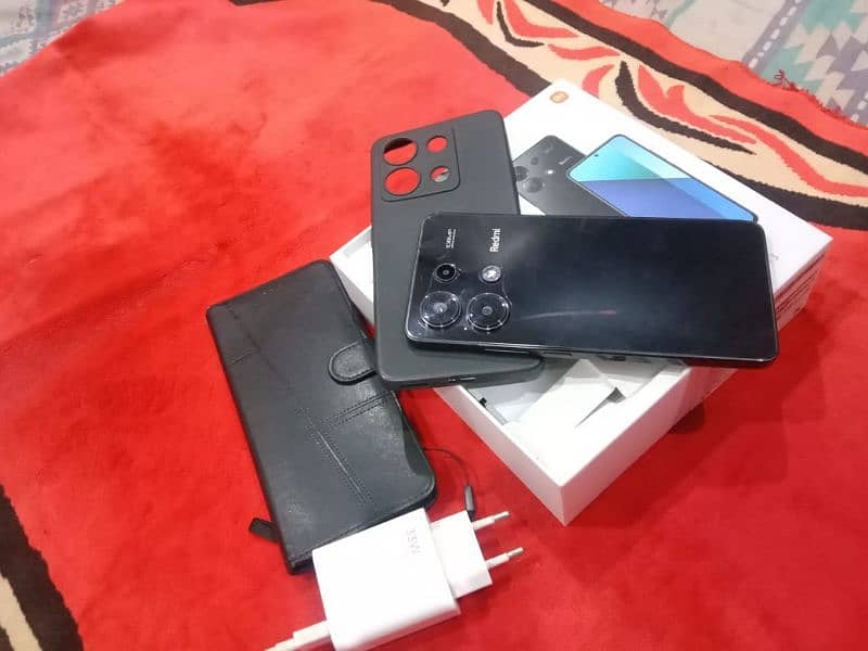 Redmi note 13.  RAM  8+4.256   box and charger pouch.  book cover. 0