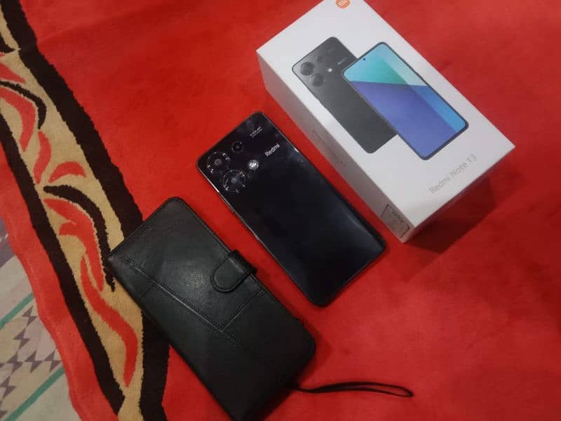 Redmi note 13.  RAM  8+4.256   box and charger pouch.  book cover. 2