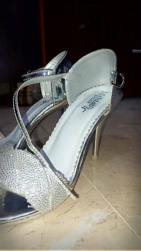 SILVER HIGH HEELS. 1