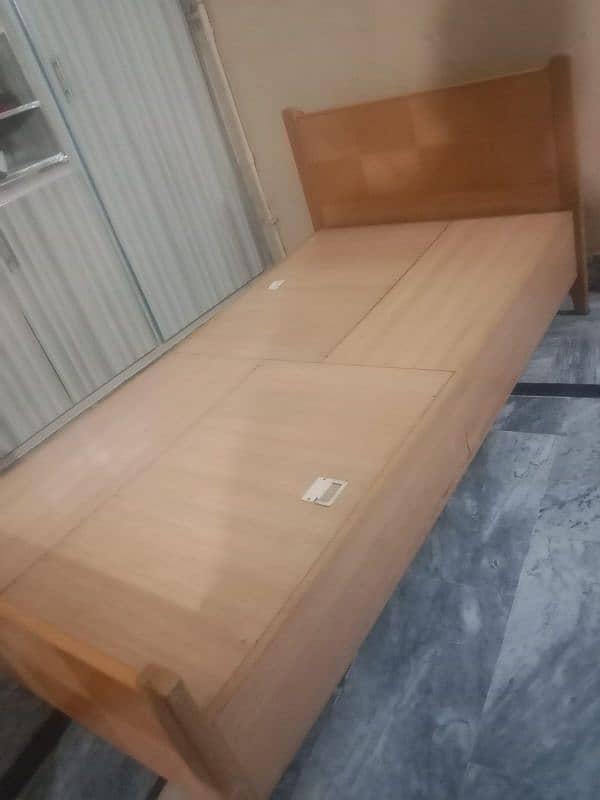 2 Single beds with inside storage 1