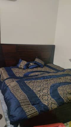 Wooden double bed without mattress