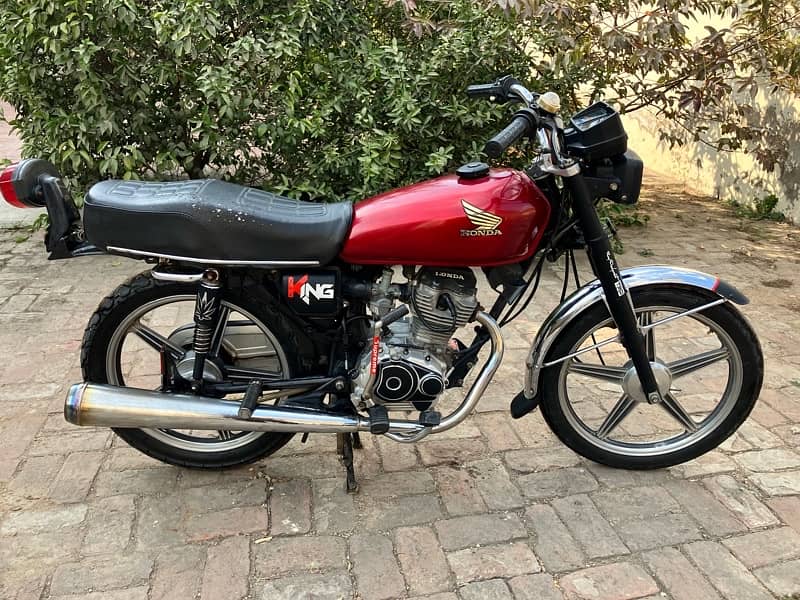 Honda 125 with newly installed alloy wheel and golden number (MBK-125) 0