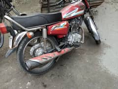 Honda 125 with golden digits