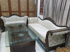 seven seater sofa set with sofa cover. with two wood and mirror table