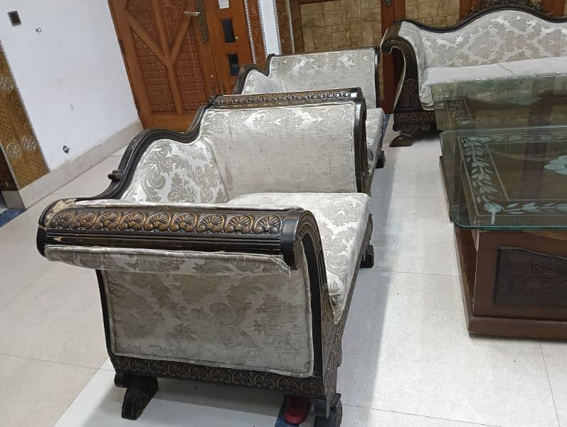 seven seater sofa set with sofa cover. with two wood and mirror table 1