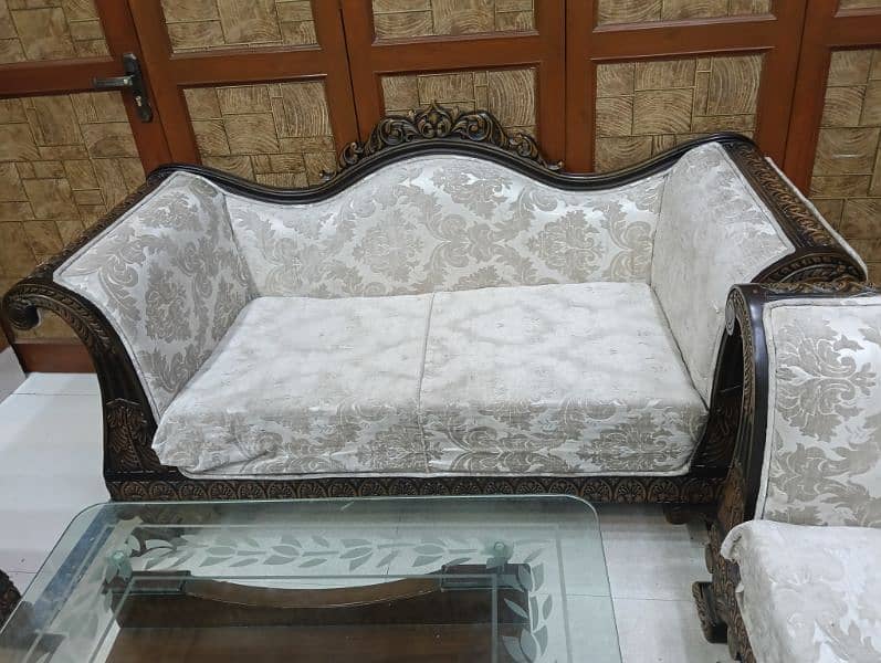 seven seater sofa set with sofa cover. with two wood and mirror table 4