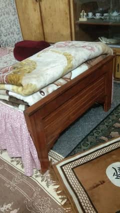 2 single wooden bed