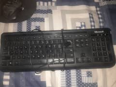 Black keyboard and mouse(including mouse pad)