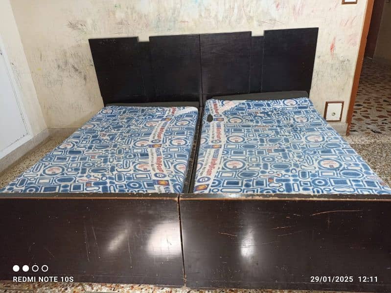 2 single beds with mattresses 1