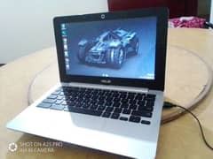 Asus Chromebook laptop with charger