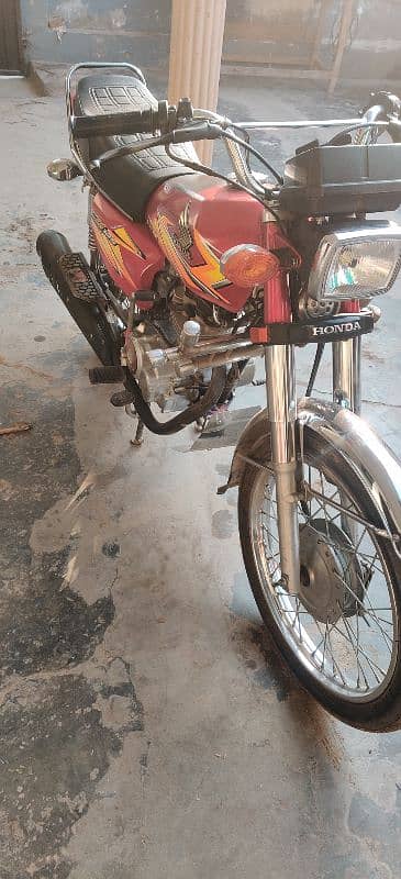 Honda 125 good condition all Punjab number 4