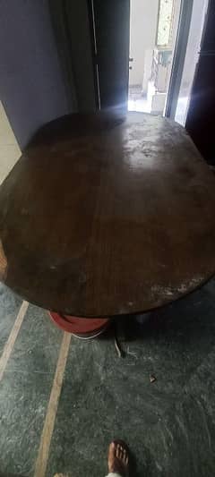 Dining table with solid wood base and one iron stand