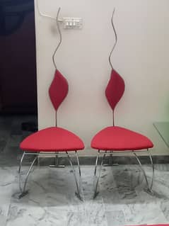 Two stylish red chairs