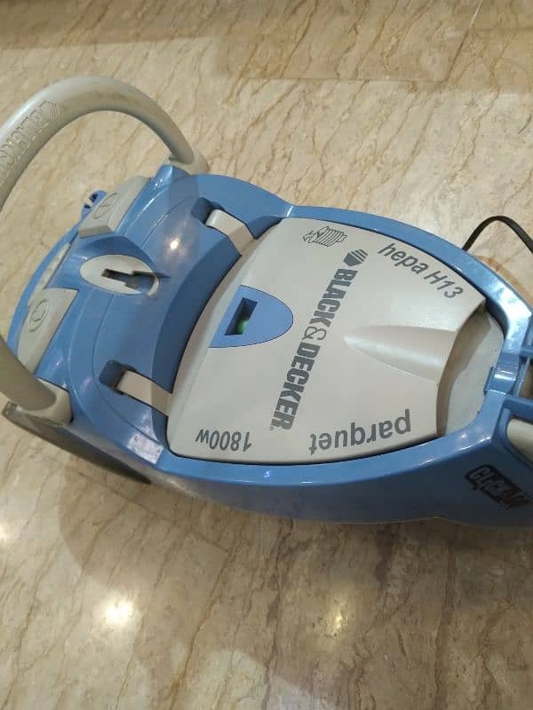 vacume cleanar. black and decker made by England  100 parents ok 1