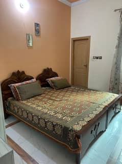 Double wooden bed for sale