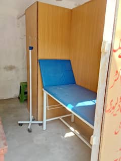 clinic bed and drip stand