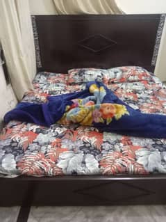 double bed with mattress dressing and side tables