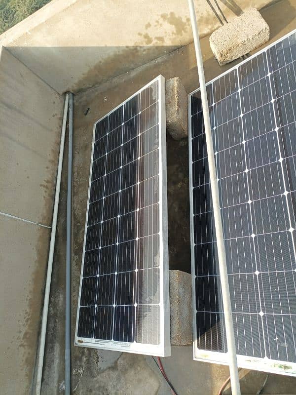 Two solar panels along with battery and controller. 7