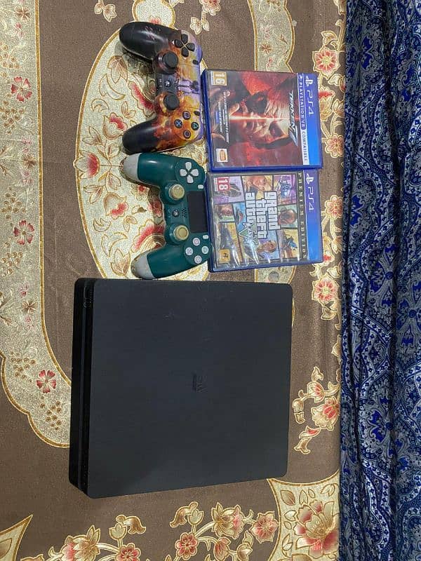 PS4 with 2 controllers and two games 0