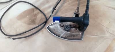 Steam iron in good and running condition.