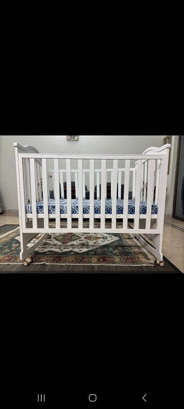 2 crib, 1 dining seat, 1 baby available for sale 1