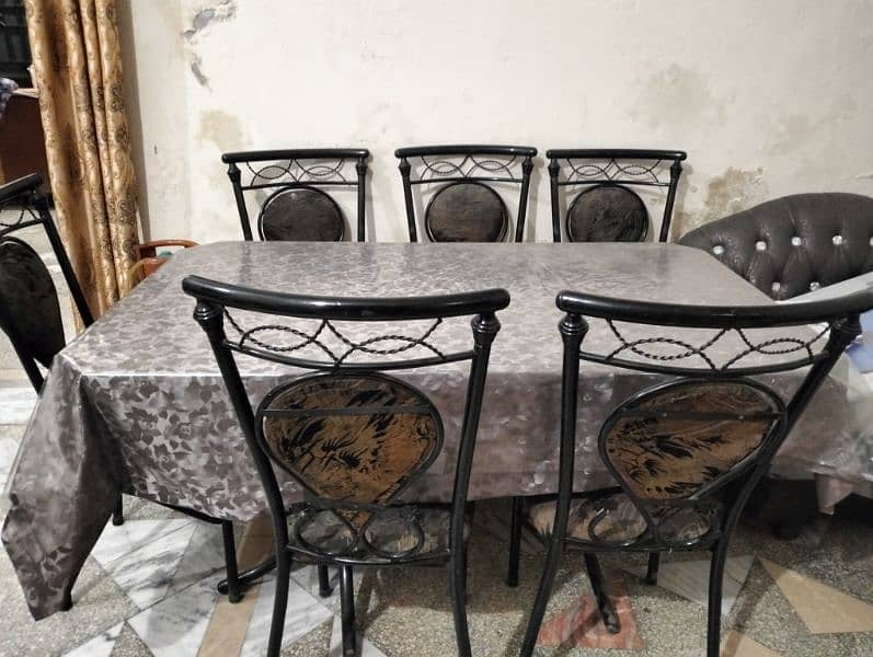 blackish dining table in new condition 1