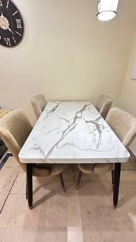 Elegant White Marble Dining Table with Beige Chairs Gold Black Accents 3