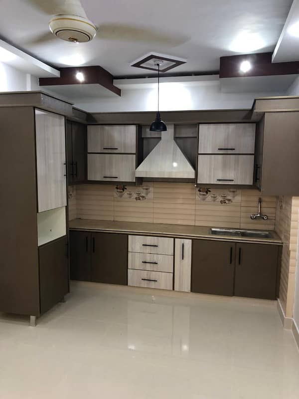 Flat For Sale Bhayani Heights Block 4 Gulshan-e-Iqbal Karachi Main Maskan Chowrangi. Ground Floor 2 Bedroom Drawing Lounge American kitchen Tile Flooring 0