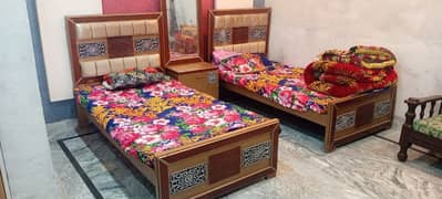 two bed set with table