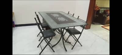 Dining Table with 5 Foldable Iron Chairs.