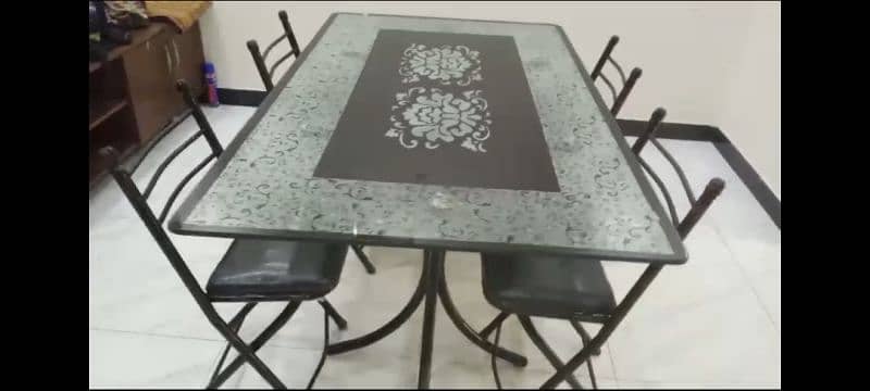 Dining Table with 5 Foldable Iron Chairs. 2